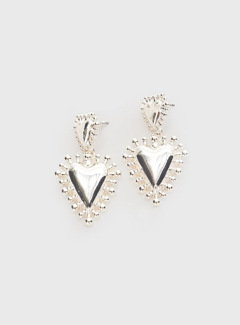 Silver-toned earrings Drop design, heart-shaped charm, stud fastening