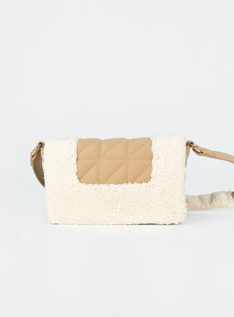 Shoulder bag Upper: 70% polyester 30% faux fur Lining: 100% polyester Faux fur detailaing Quilted material Button fastening at front Gold toned hardware Fixed strap Two internal pockets Flat base