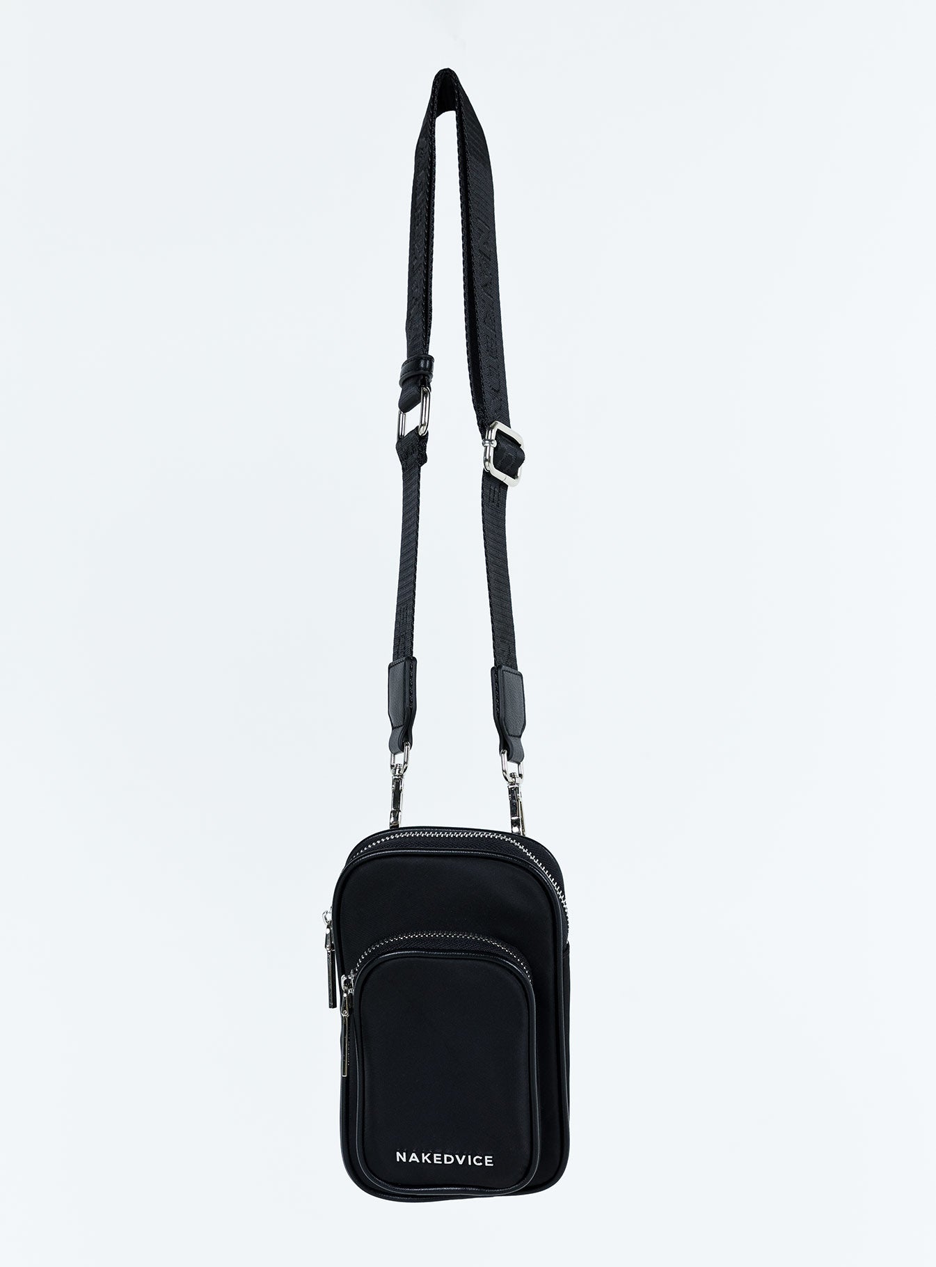 Crossbody bag Nylon material Silver toned hardware Zip fastening Removable and adjustable crossbody strap Card slip at back