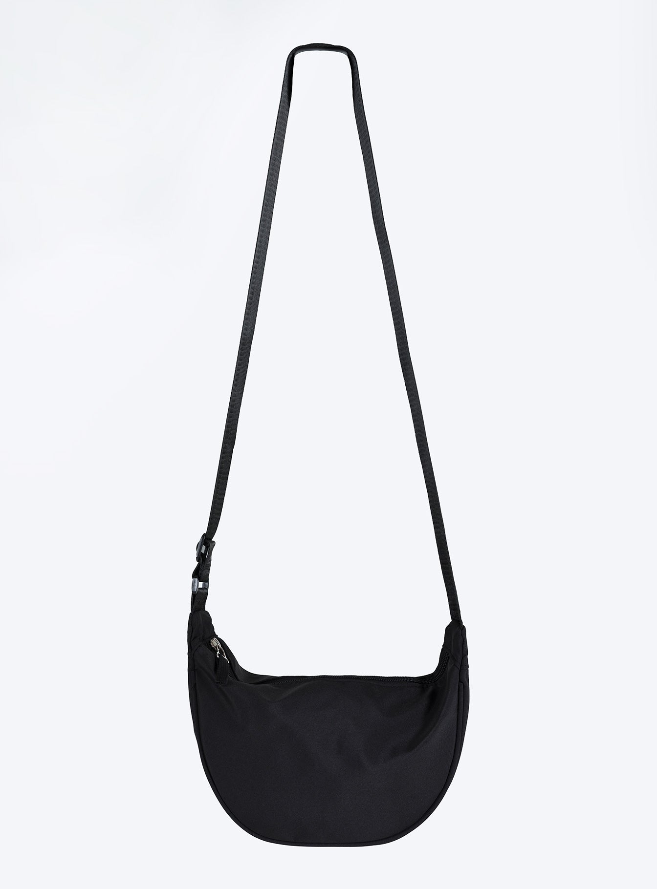 Black crossbody bag Nylon material Adjustable strap Zip fastening Internal slip pocket Silver toned hardware