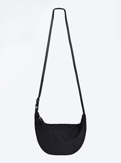Black crossbody bag Nylon material Adjustable strap Zip fastening Internal slip pocket Silver toned hardware