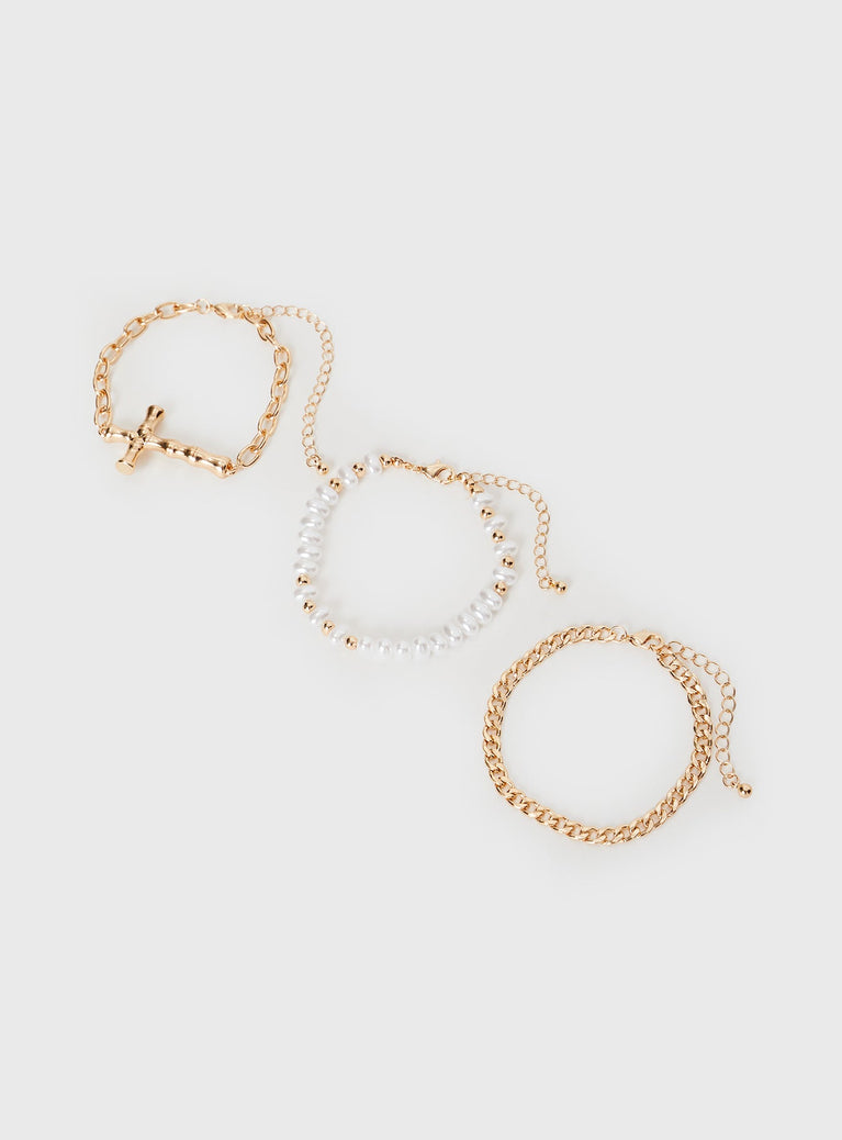 Gold-toned bracelet pack Three pack, all individually different, pearl detail, charm detail, lobster clasp fastenings 