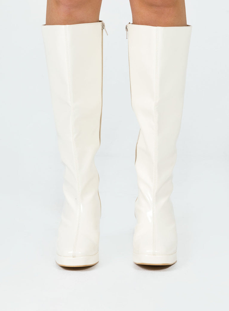 Cream knee high boots Faux glossy leather  Zip fastening at side  Block heel  Rounded toe 