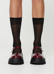 Faux patent leather loafer Platform base, treaded sole, single strap upper, silver-toned hardware, buckle fastening