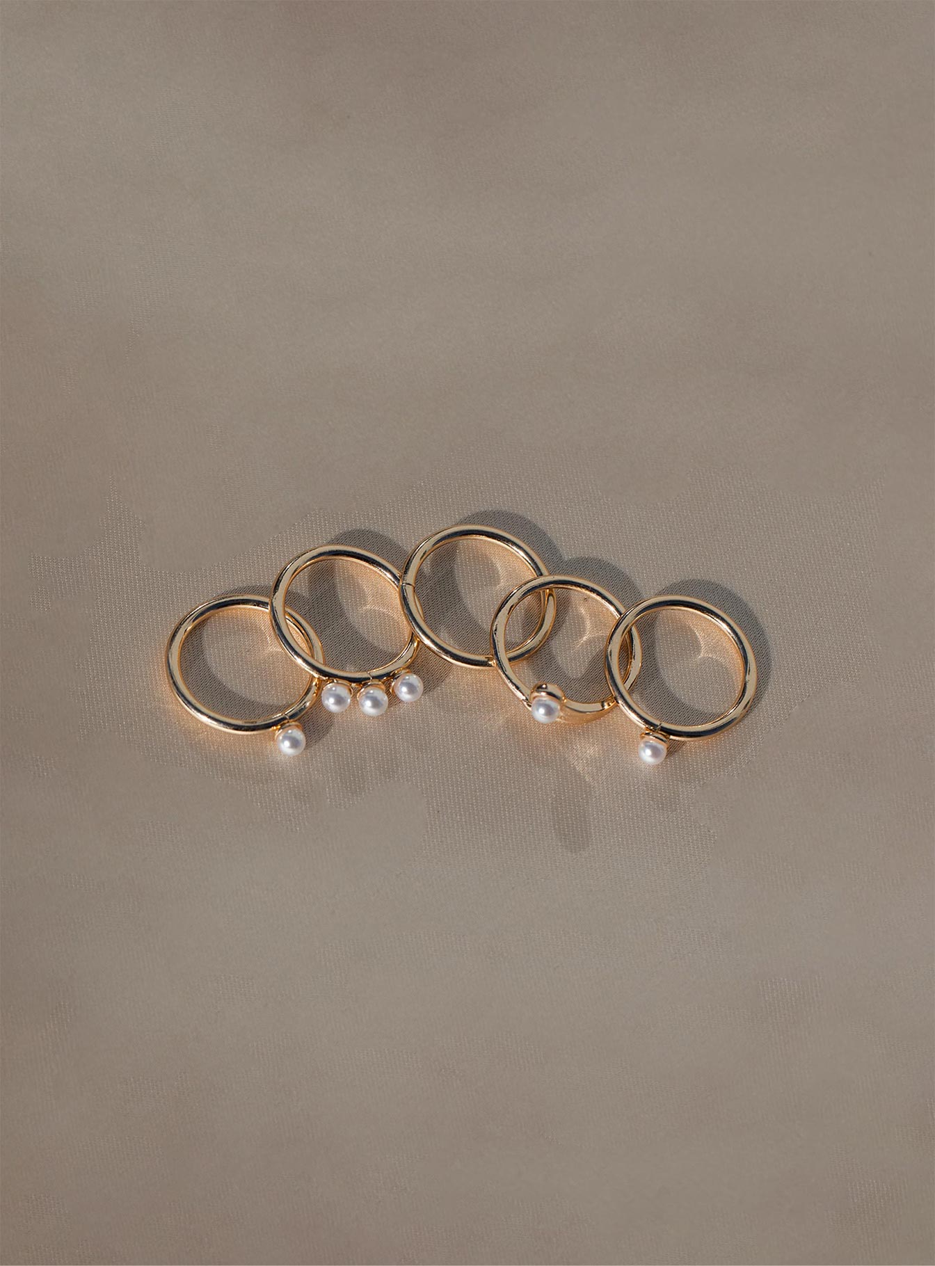 Rings Pack of five Gold-toned band  Pearl charm 