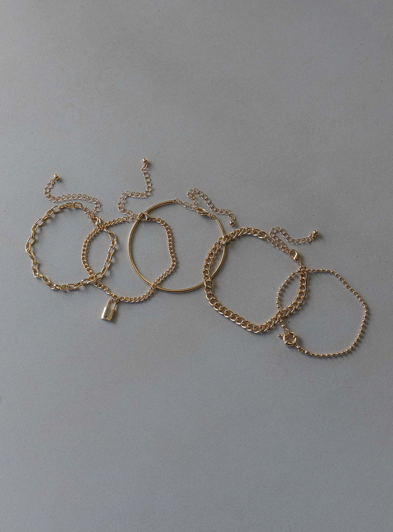 Bracelet Pack of five  These can be worn separately Chain styles  Solid band style  Locket pendant  Lobster clasp fastening 