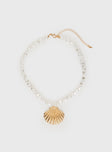 Necklace  beaded pearl detail, gold-toned hardware, shell drop charm  Lobster clasp fastening- adjustable sizing