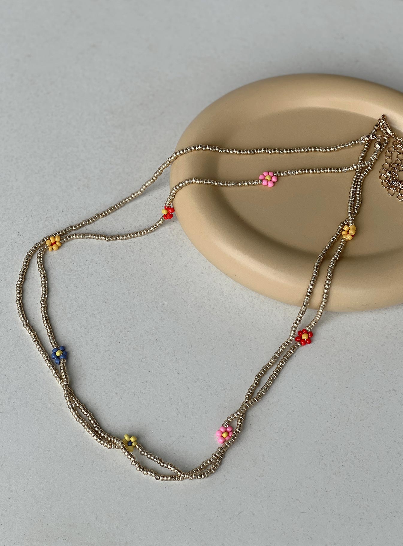 Waist belt Beaded design Coloured flower beads Double layer Gold toned hardware Lobster clasp fastening Adjustable length