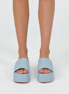 Sandals Faux leather  Wide upper  Slit at side for movement Square toe  Padded footbed  Platform base 