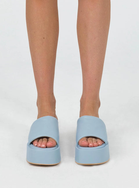 Sandals Faux leather  Wide upper  Slit at side for movement Square toe  Padded footbed  Platform base 