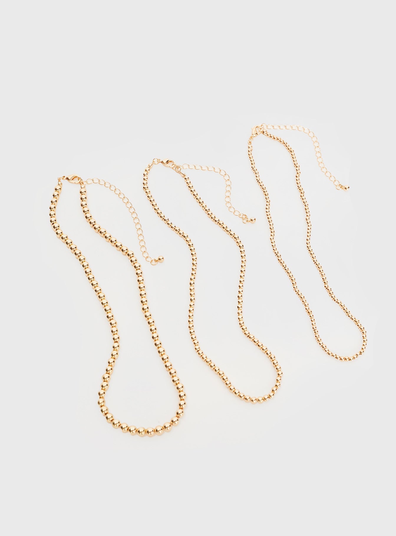 Gold-toned necklace Three seperate necklaces, lobster clasp fastening