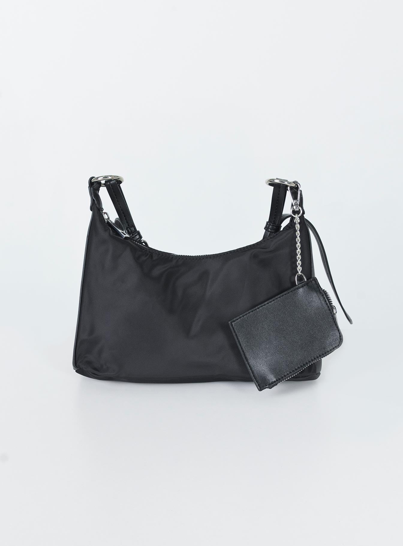 Crossbody bag  Princess Polly Exclusive Nylon & faux leather material  Silver-toned hardware  Chain shoulder strap  Removable & adjustable crossbody strap  Removable coin purse  Zip fastening Flat base   Fully lined 