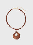 Necklace Beaded design, wooden pendant, gold-toned lobster clasp fastening