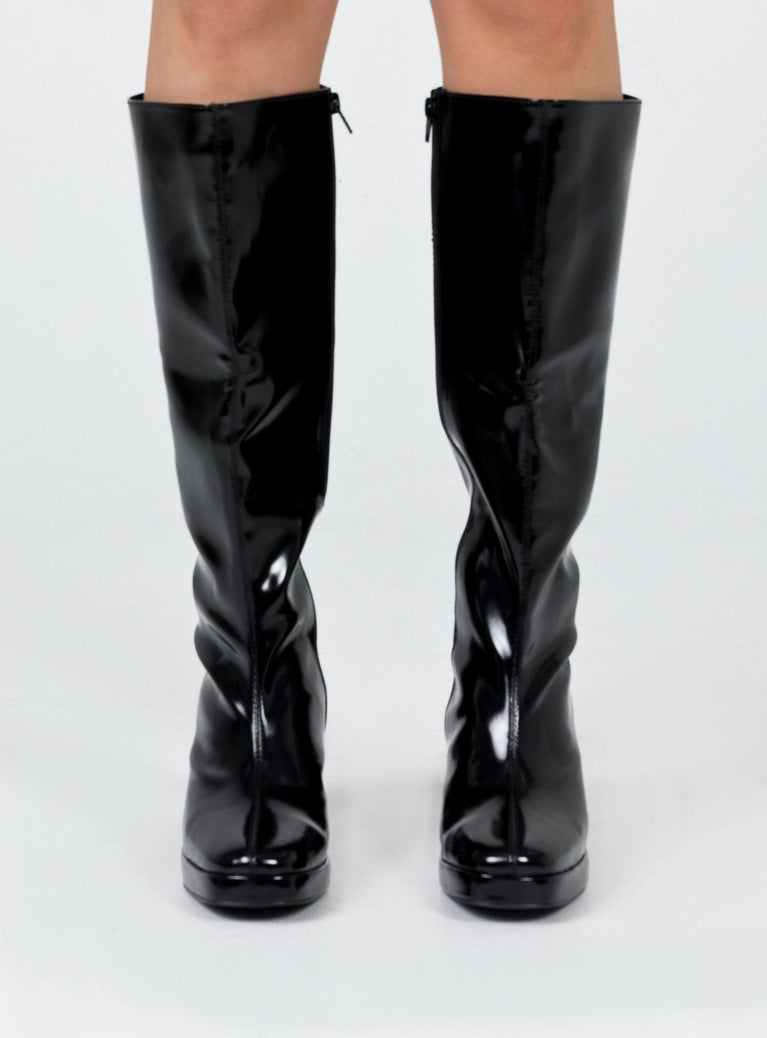 Knee high boots Princess Polly Exclusive Upper: 100% PU Lining: 100% fabric Outsole: 100% rubber Faux glossy leather  Zip fastening at side  Block heel  Rounded toe 