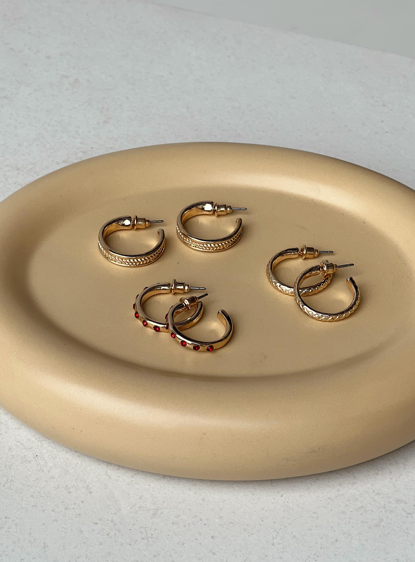 Earrings Pack of three Hoop styles Ruby gem details