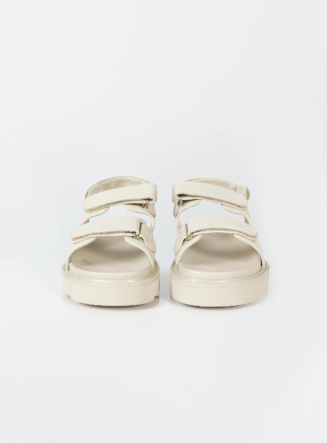 Sandals Faux leather material Twin velcro upper Ankle strap with velcro fastening Chunky treaded sole Padded footbed