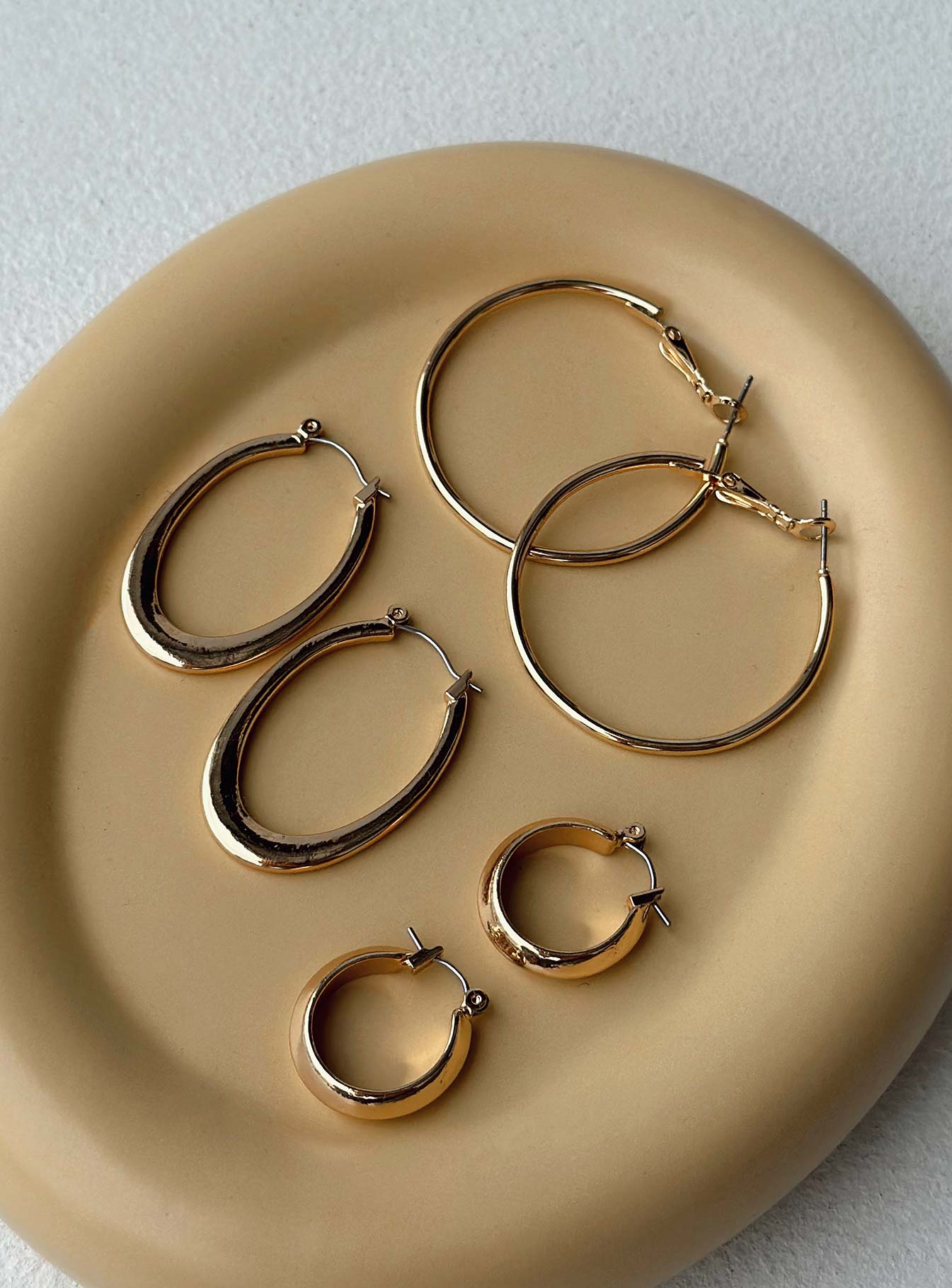 Earrings Pack of three Gold-toned Hoop fastening