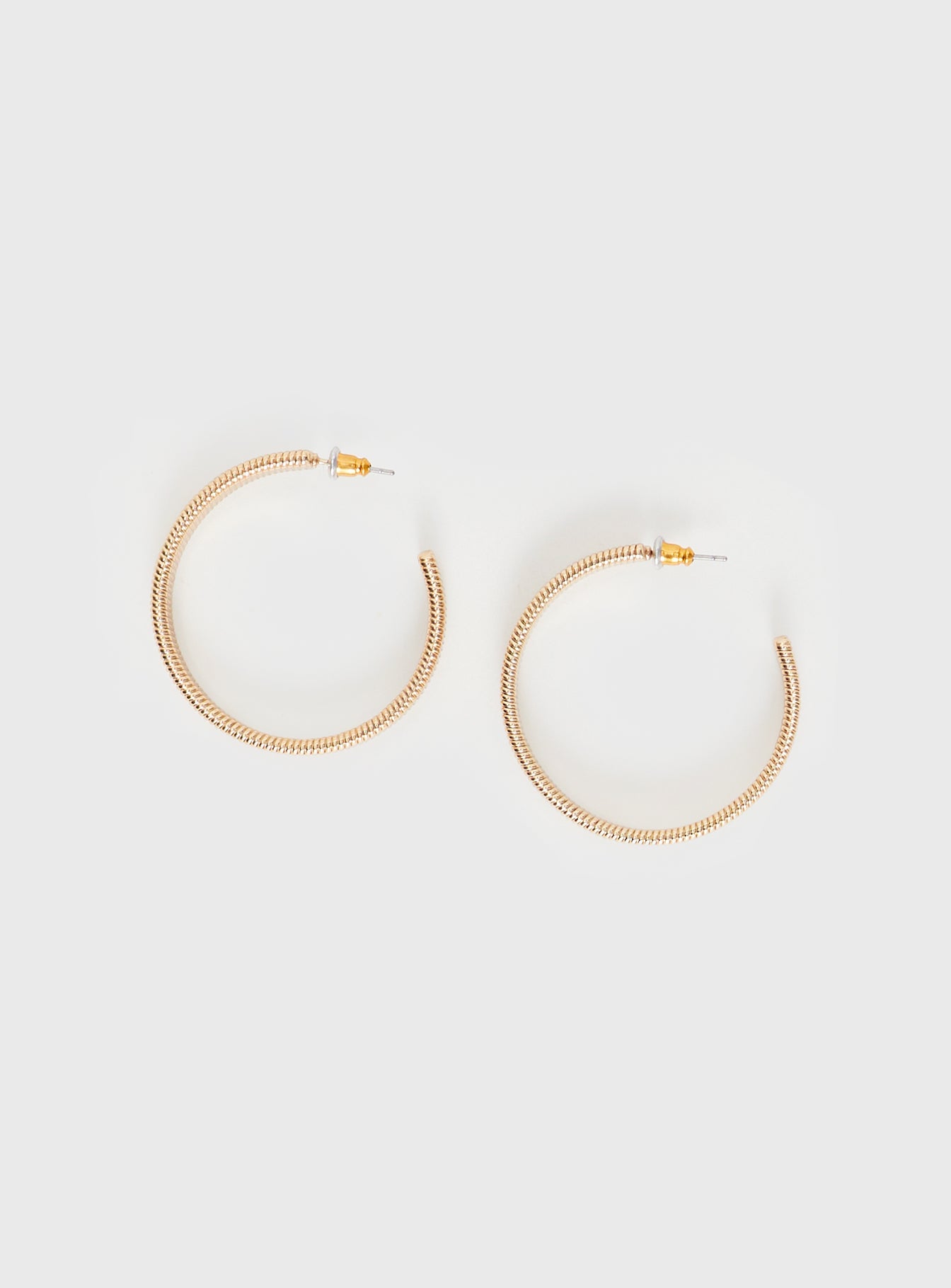 Gold-toned earrings Hoop style, stud fastening