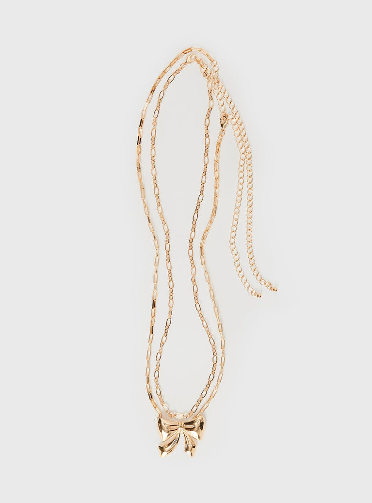 Gold-toned chain belt Two separate chains, large bow pendant, lobster clasp fastening Princess Polly Lower Impact