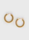 Gold-toned hoop earrings Clasp fastening