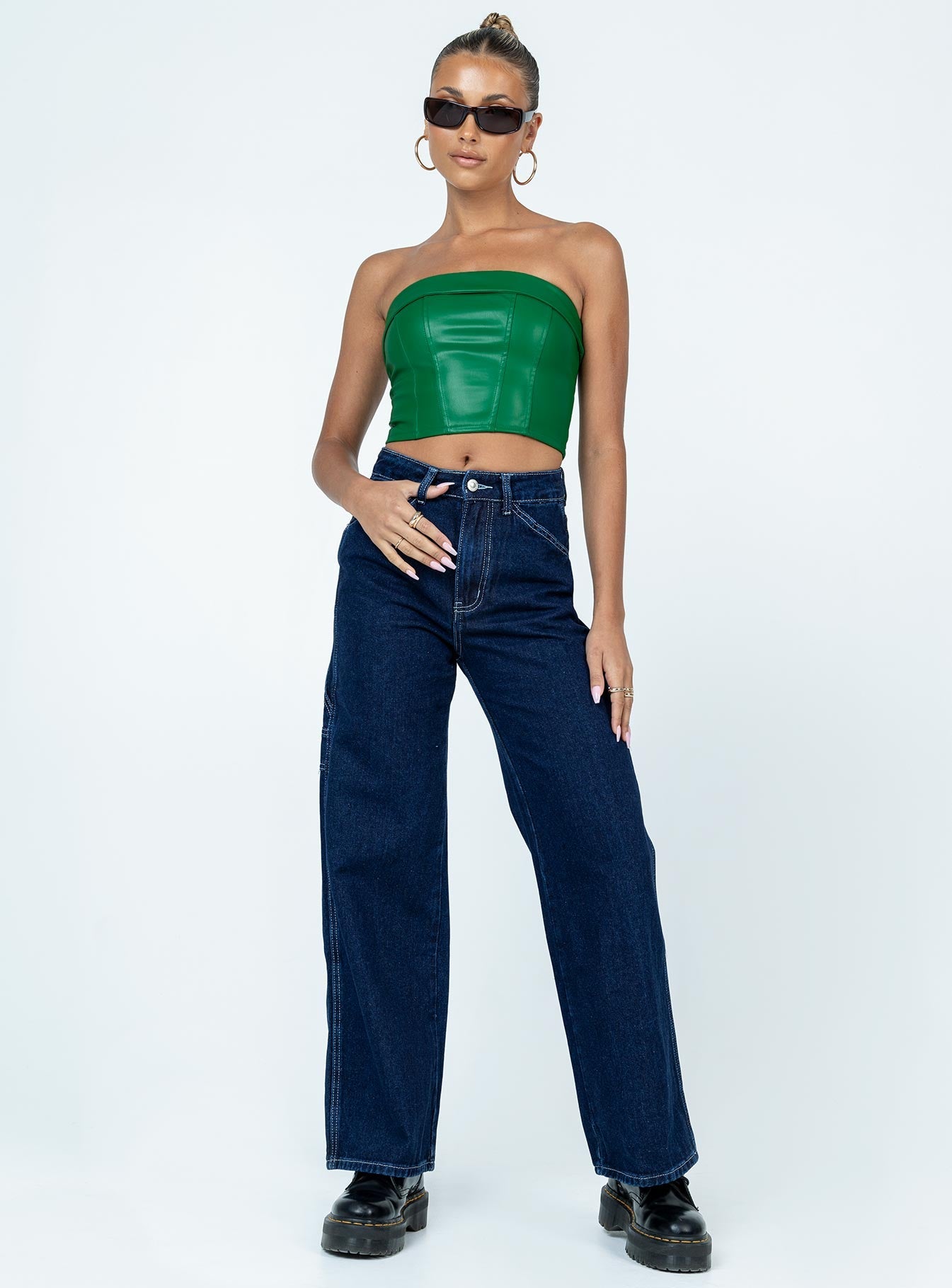 Strapless top Faux leather material  Inner silicone strip  Zip fastening at back Slight stretch