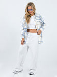 Oversized shirt Soft flannelette material Plaid print Button front fastening Twin chest pockets Single button cuff