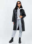 PU coat  Oversized fit  100% PU  Classic collar  Four front flap pockets  Zip fastening  Inner drawstring waistband  Satin lined 
