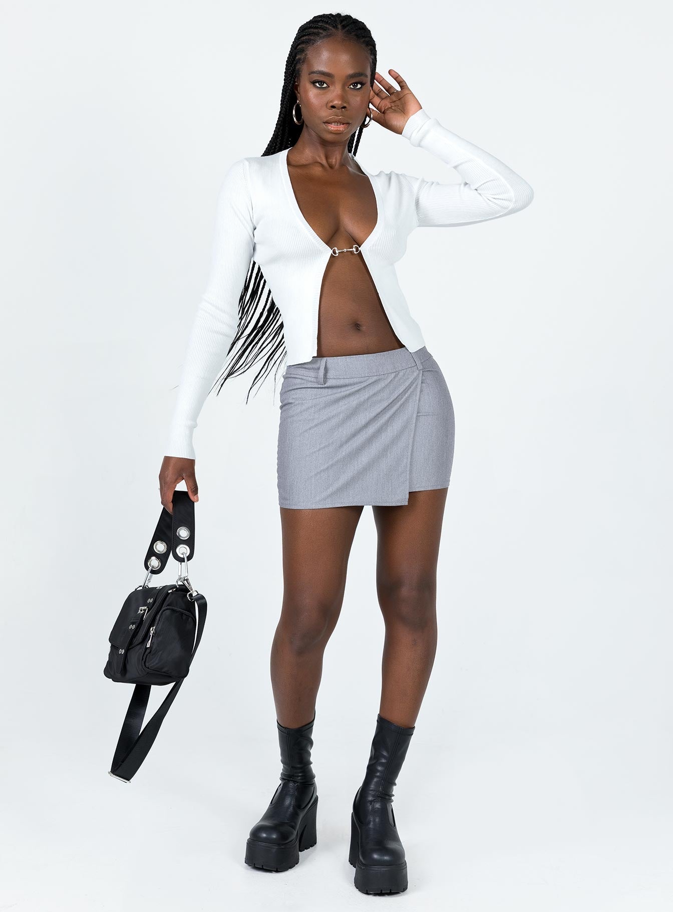 Long sleeve top Ribbed material Open front design Plunging neckline Fixed chain link at bust Good stretch