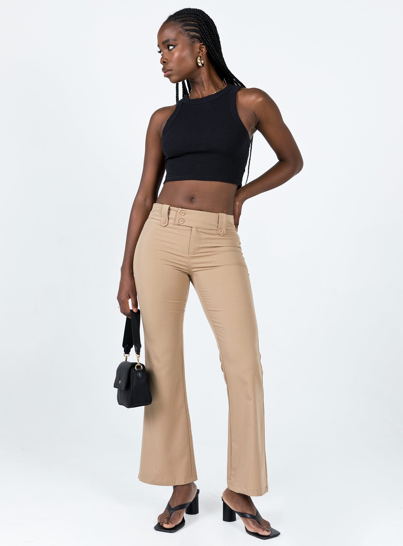 Pants Belt looped waist Zip & button fastening Faux back pockets Button detailing throughout Low waisted Slim leg Flared hem