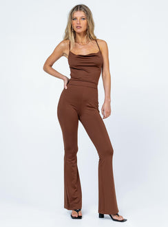 Jumpsuit  Slim fitting  Princess Polly Exclusive 92% recycled fibers 8% elastane  Thin shoulder straps  Straps can be worn crossed over or straight back  Elasticated waistband  Flared leg 