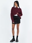Black mini skirt Quilted material High rise Invisible zip fastening at back Button detail at front