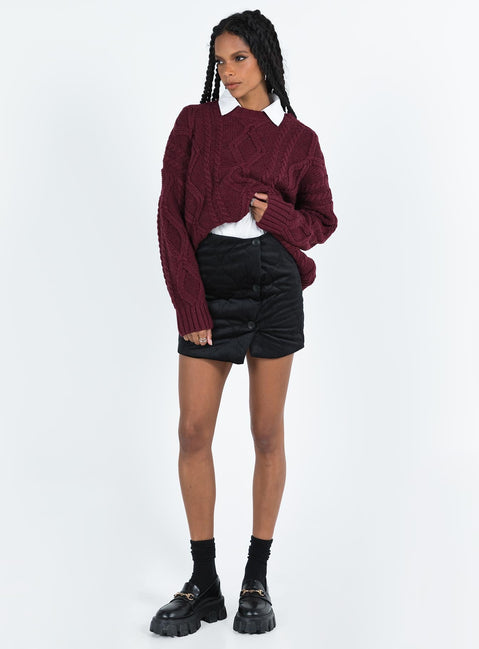 Black mini skirt Quilted material High rise Invisible zip fastening at back Button detail at front