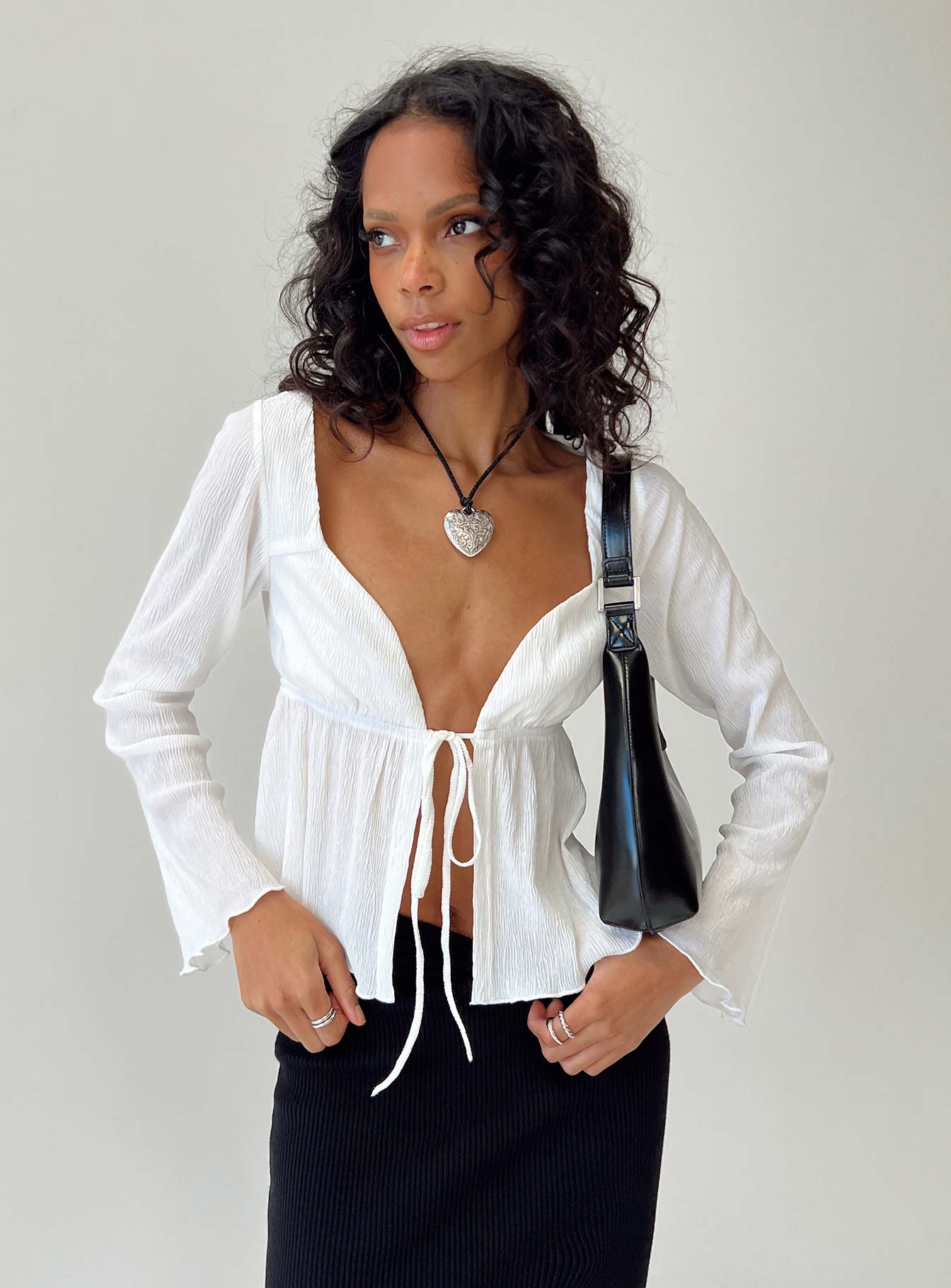 Long sleeve top Crinkle material V neckline Tie fastening at bust Good stretch Partially lined