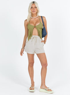 Green crop top Textured material Halter neck tie fastening Adjustable coverage Clasp fastening at back Elasticated back strap Layered double pointed hem Good stretch  Lined bust 