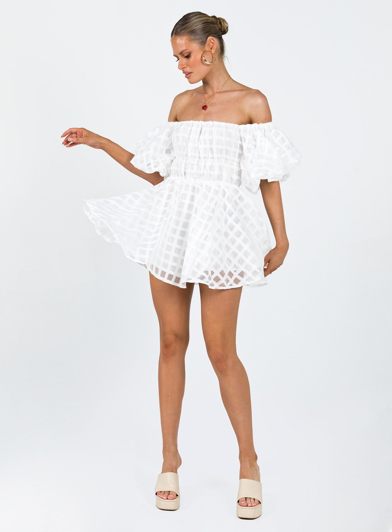 White mini dress Sheer material Off the shoulder design Puff sleeve Elasticated bands at waist
