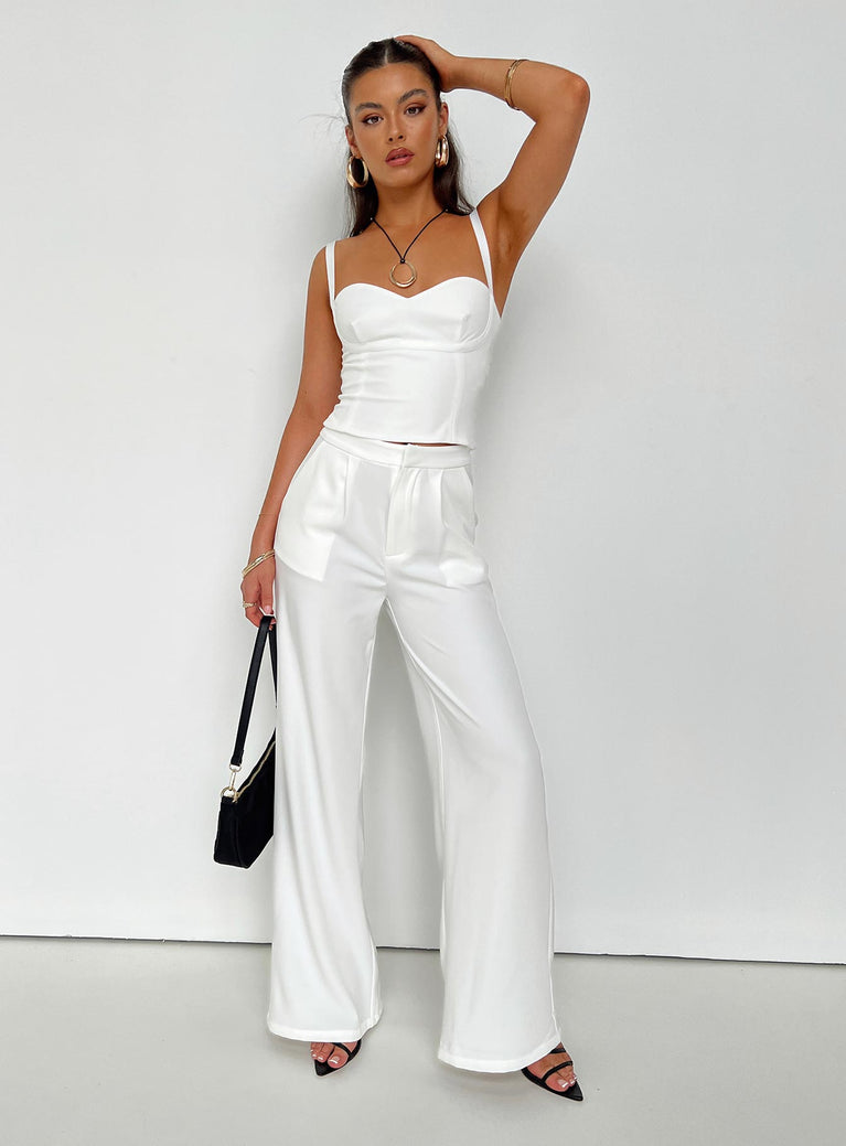 Matching set Crop top Adjustable shoulder straps Sweetheart neckline Zip fastening at back Tailored pants Zip and clasp fastening Twin hip pockets Stuble pleats at waist Straight leg