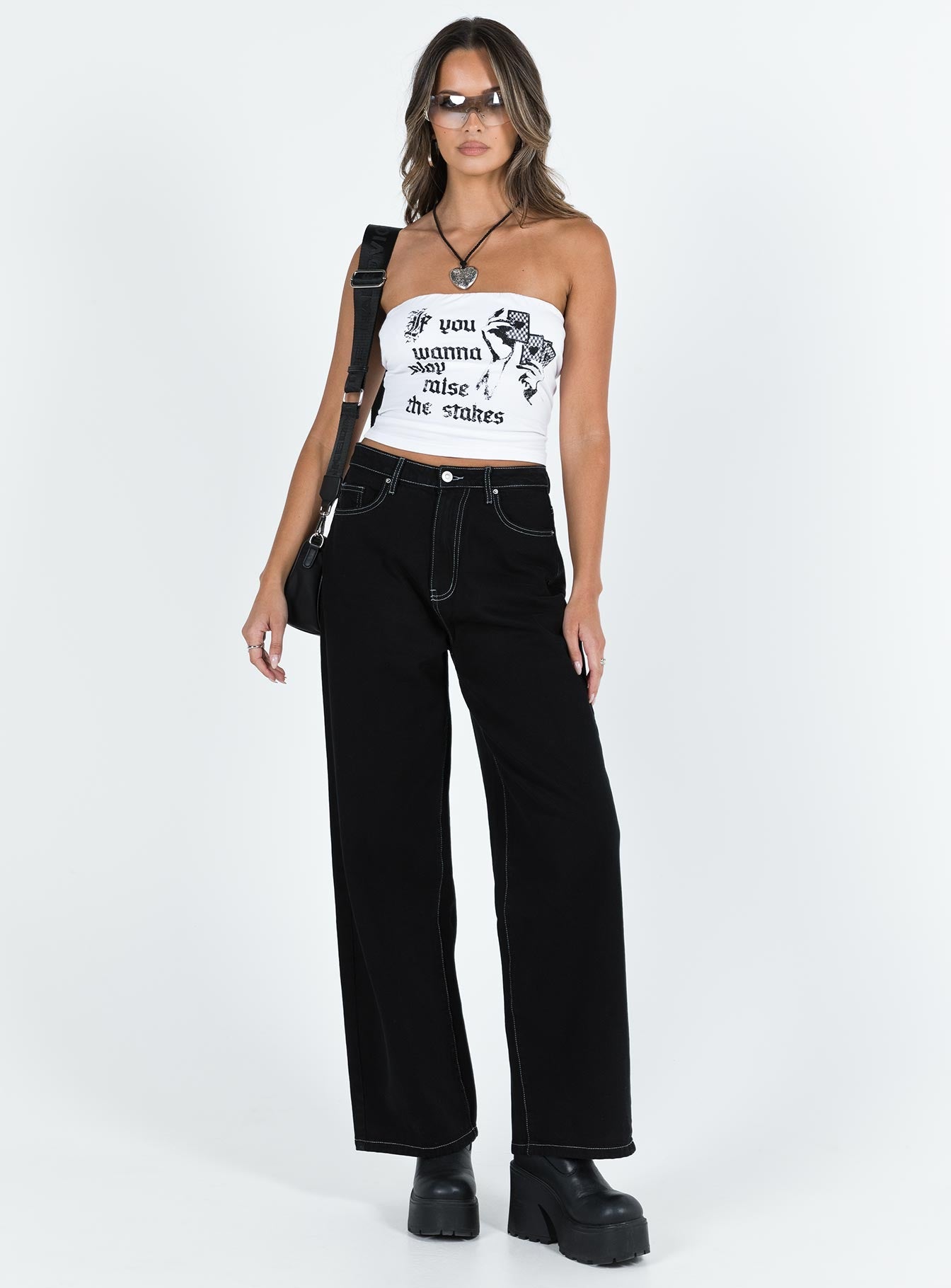 Jeans High rise Black denim Belt looped waist Zip and button fastening Classic five pocket design Branded patch at back Wide leg