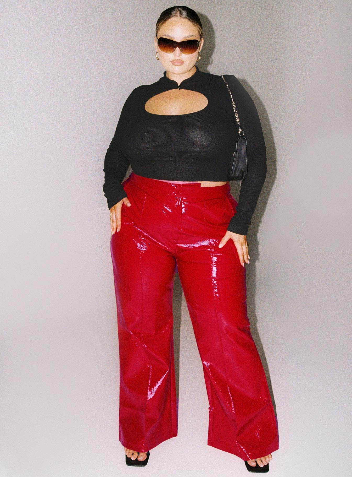 Black long sleeve crop top Ribbed material Cut out circle Button fastening at neck High neckline Slim fitting