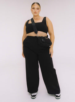 Black matching set Crop top Fixed straps Invisible zip fasting at side High waisted pants Wide relaxed leg Belt loops at waist Zip & button fastening