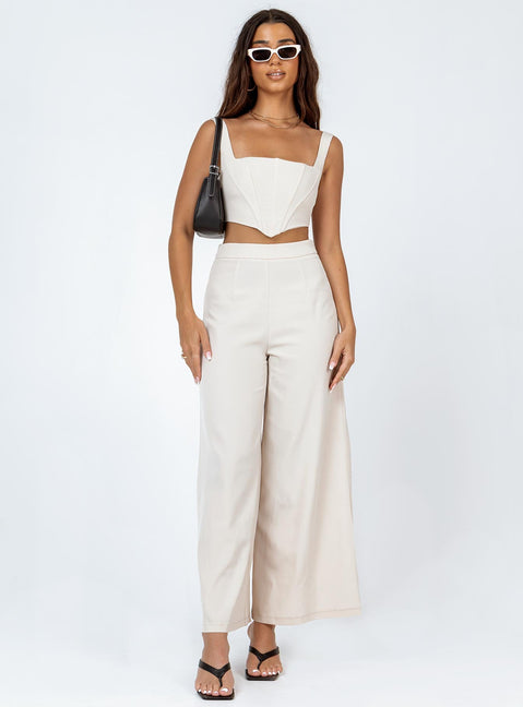 Matching set Silky material  Corset top  Boning through front  Zip fastening at back  High waisted pants  Invisible zip fastening at side  Wide leg 