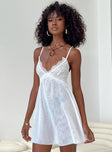 White mini dress Sheer mesh material Adjustable shoulder straps Lace bust V neckline Asymmetrical hem