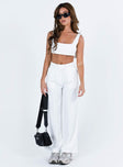 White matching set Crop top Fixed straps Invisible zip fasting at side High waisted pants Wide relaxed leg Belt loops at waist Zip and button fastening Stuble pleats at waist Twin hip pockets Non stretch  Lined top