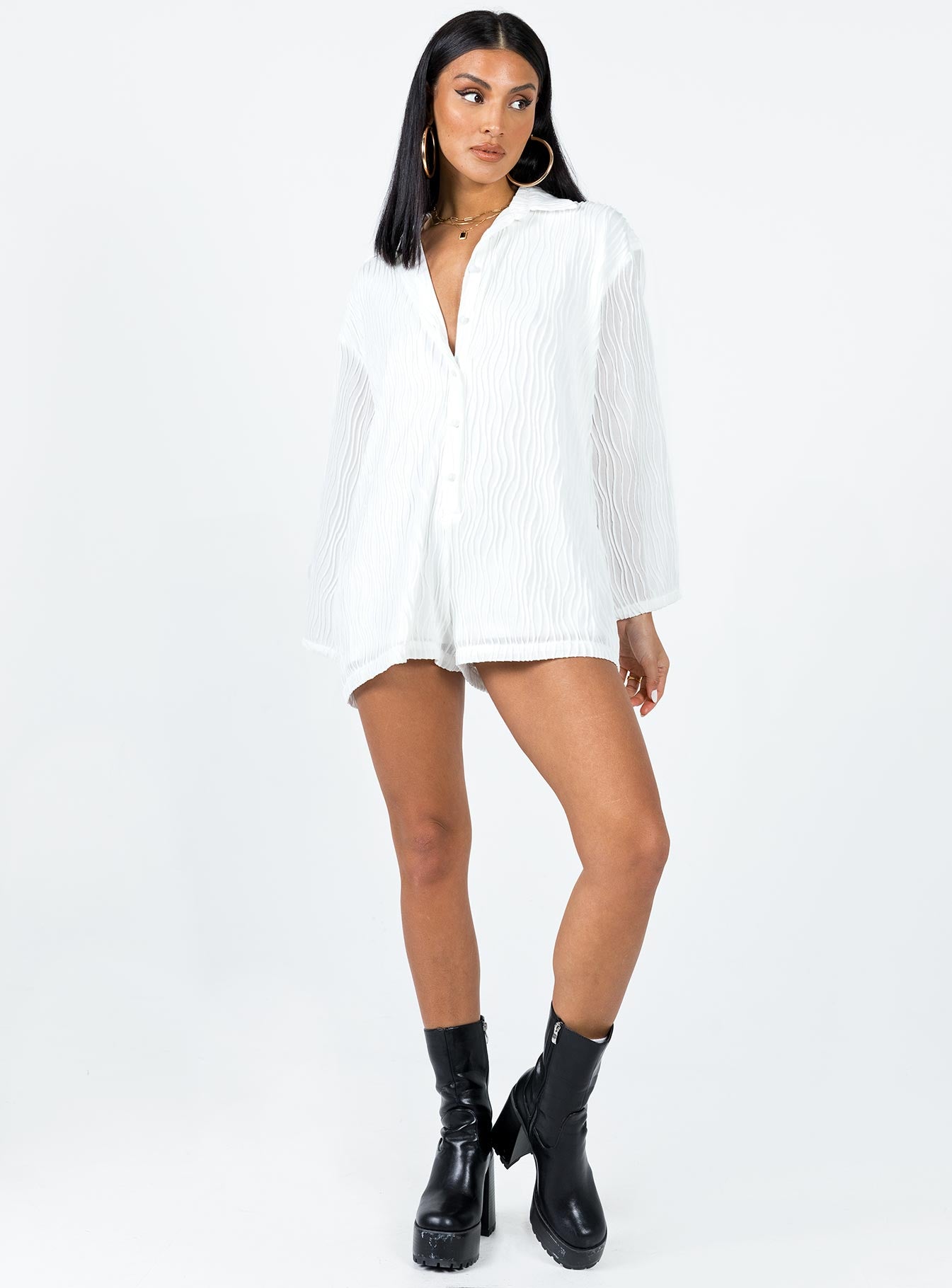 Long sleeve romper Textured material  Button front fastening  Wide sleeves 