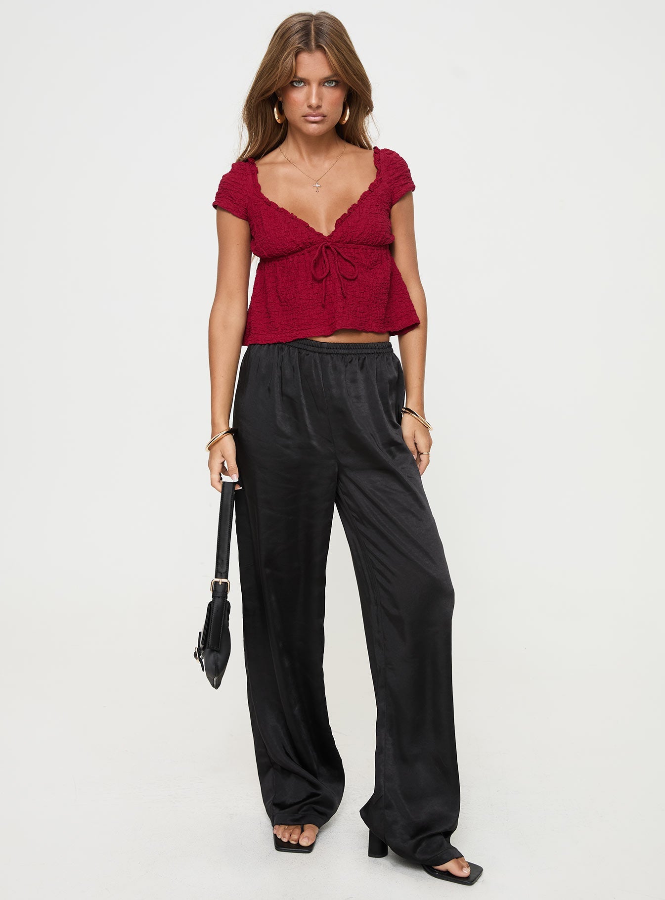 v neck top Cap sleeve, textured material, ruffle detail, tie detail at bust, elasticated back