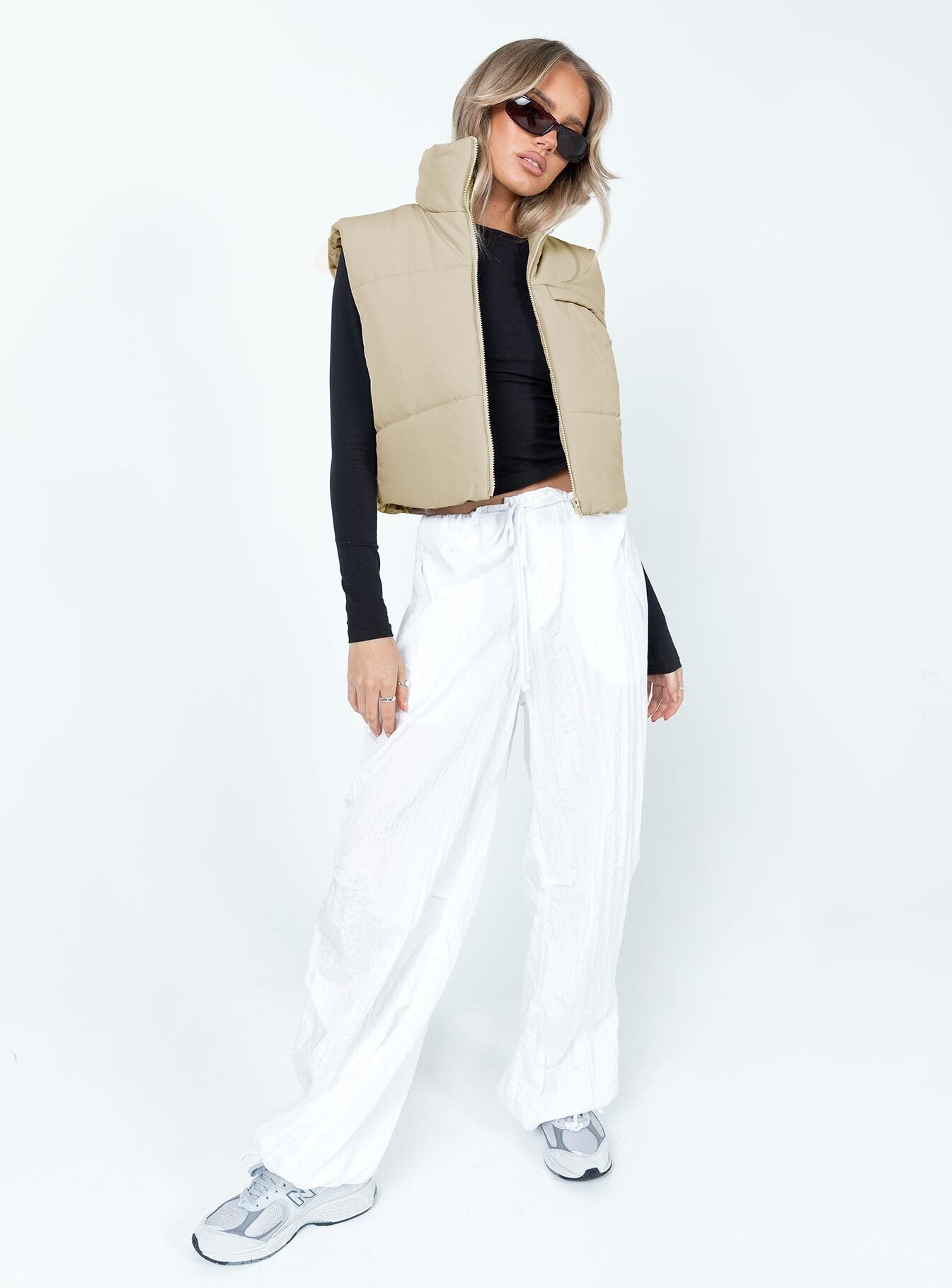 Cream puffer vest High neck Zip front fastening  Faux chest pocket 