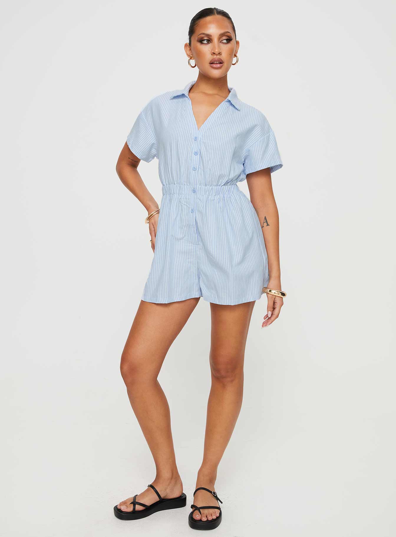 Striped romper Classic collar, button fastening down front, elasticated waistband