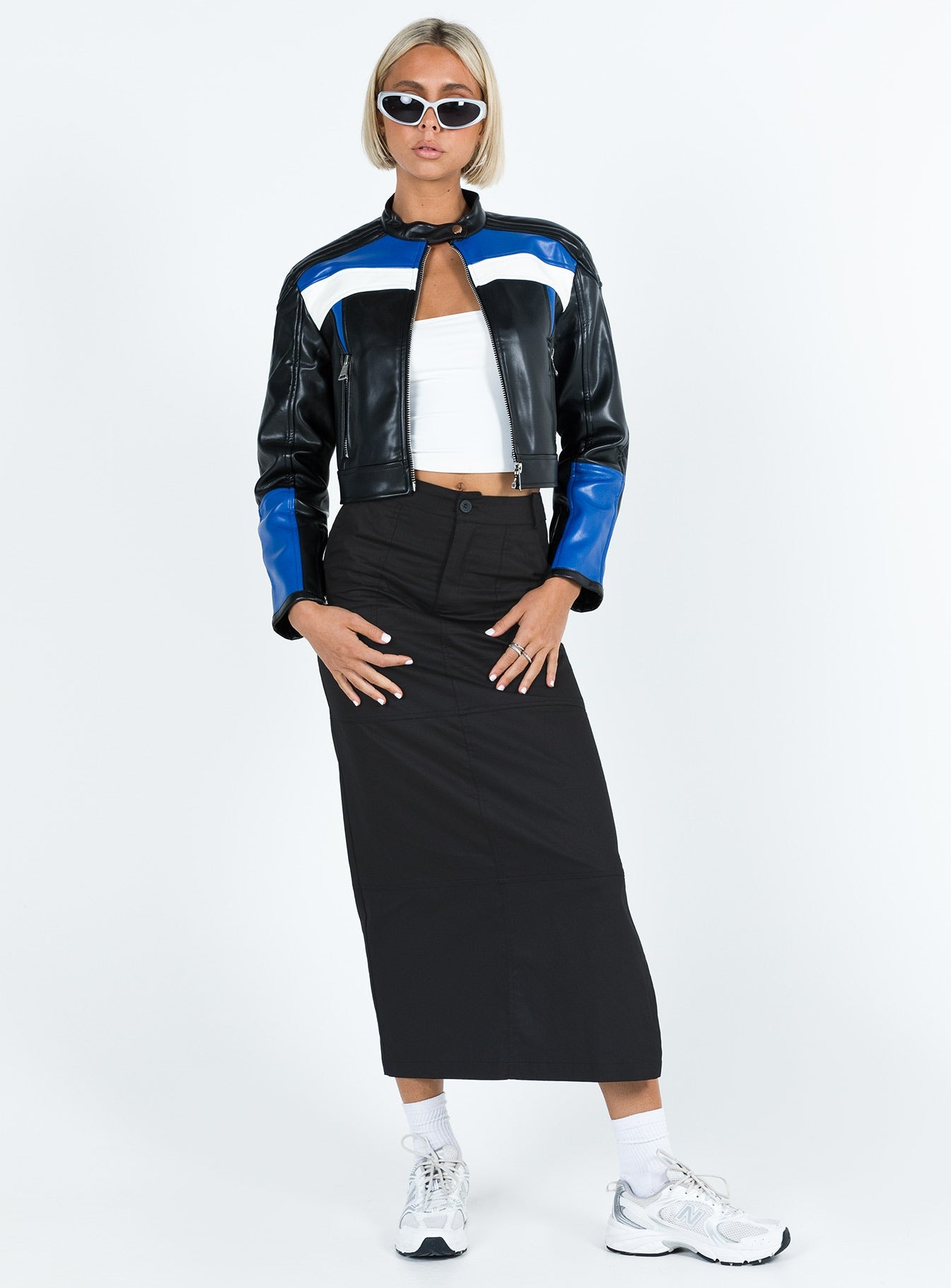 Black maxi skirt Low waist Belt looped waist Zip and button fastening Twin hip pockets Slit at side