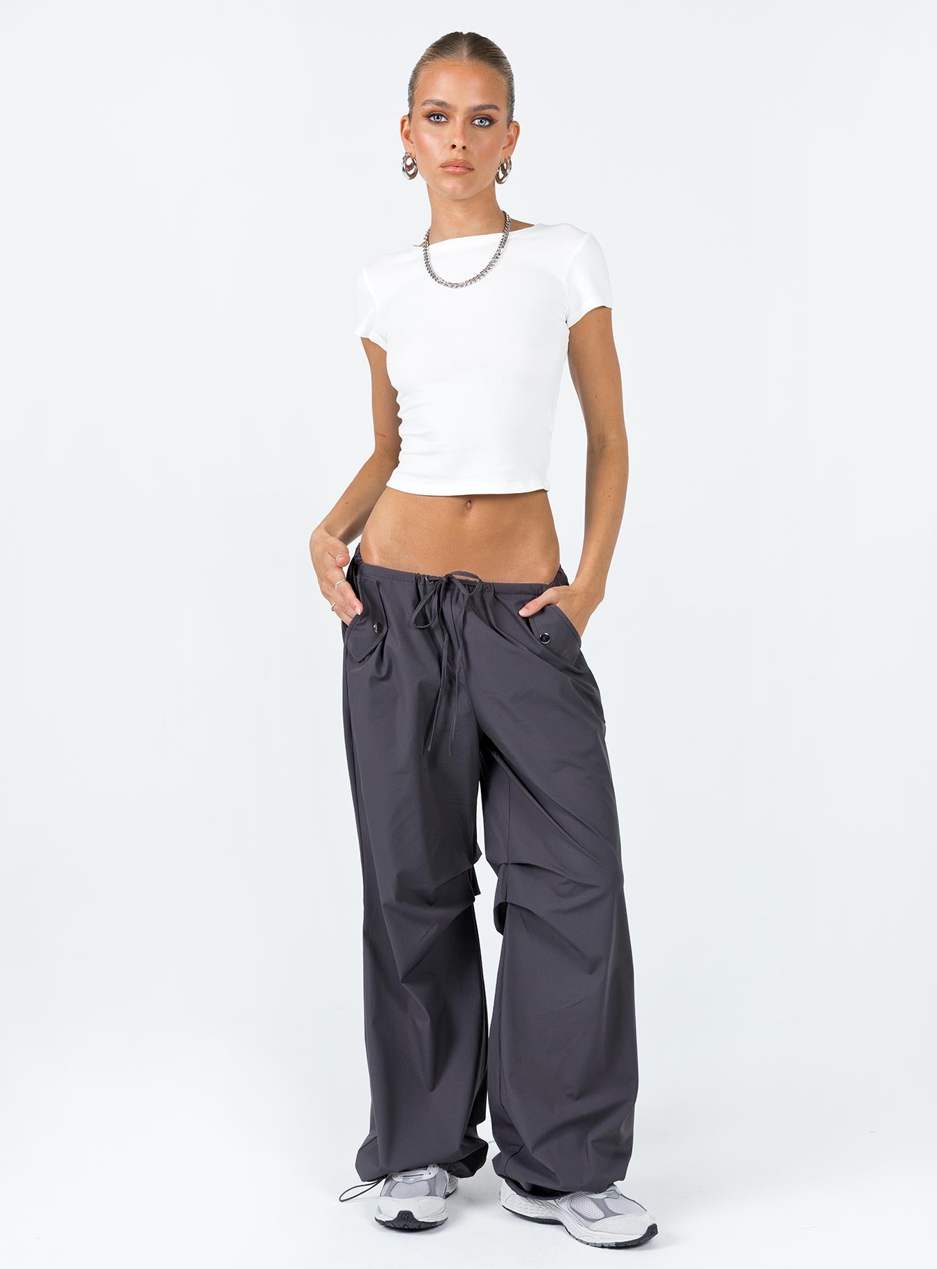 Parachute pants Elasticated drawstring waist Twin hip pockets Silver toned hardware Pleats at inner leg Wide leg Drawstring ankle 