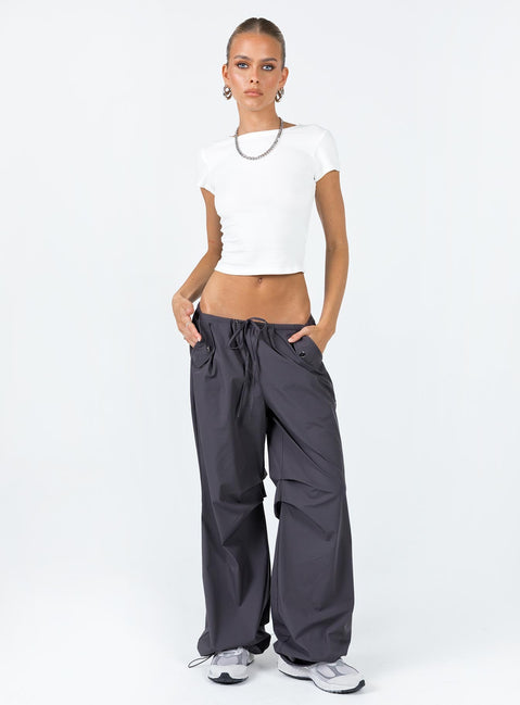 Parachute pants Elasticated drawstring waist Twin hip pockets Silver toned hardware Pleats at inner leg Wide leg Drawstring ankle 