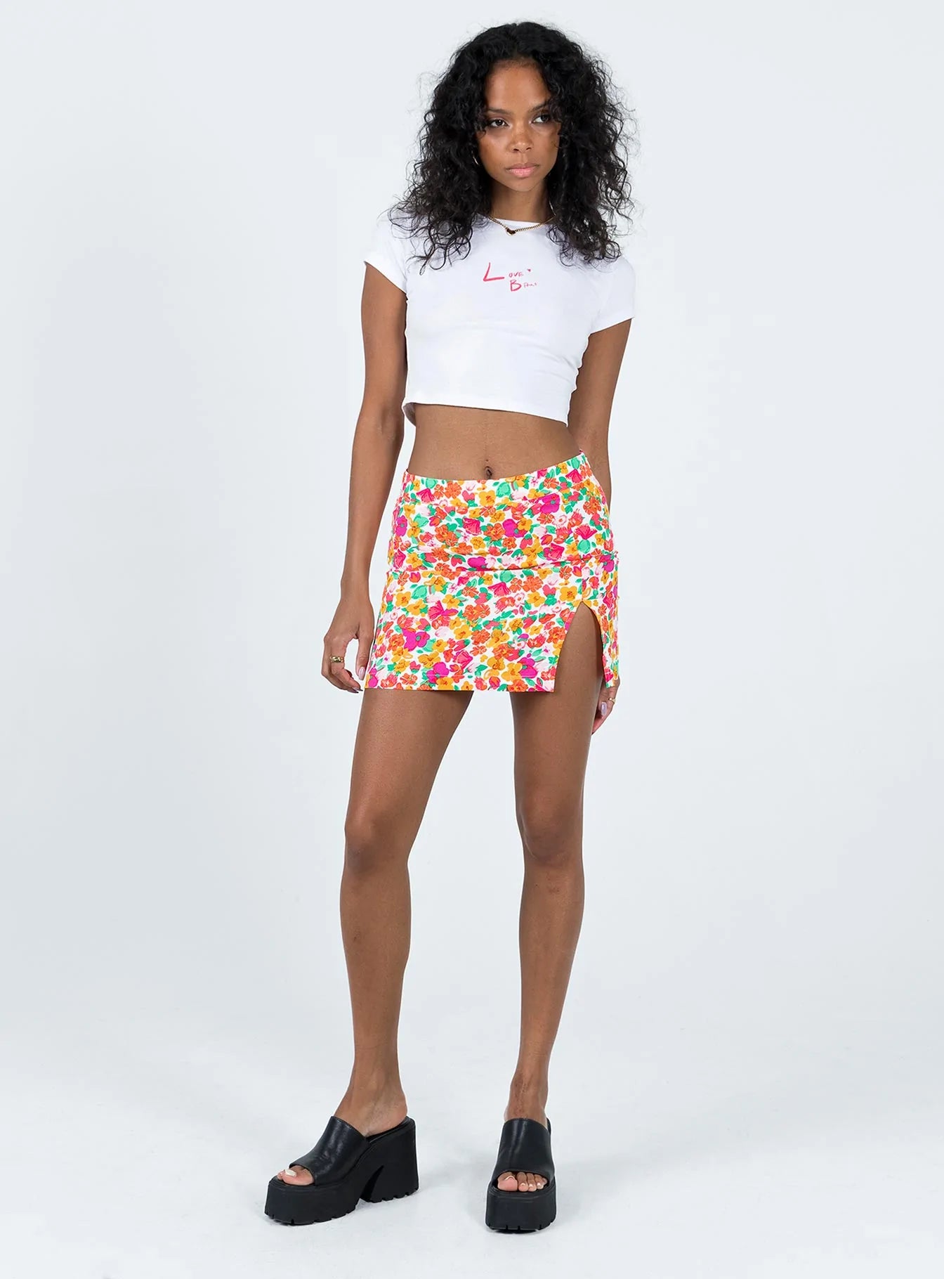 Mini skirt Floral print Invisible zip fastening at side Slit at front